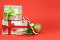 Gifts wrapped in old newspaper on red background