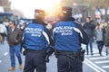 Policemen patrol on the Castellana Avenue and sunlight