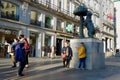 Madrid, Spain - February 18, 2022: people make photos in front of the statue of a bear, symbol of the city