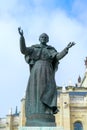 Madrid, Spain - February 29, 2020: Statue of Pope John Paul II in front of Almudena Cathedral or Cathedral of Santa Maria la Real Royalty Free Stock Photo