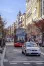 Tourist bus and taxi circulates on the street in Madrid. Royalty Free Stock Photo