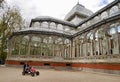 Madrid, Spain, 12.04.2022. Go-kart driver in front of Crystal Palace, Palacio de Cristal, in Retiro Park. Madrid, Spain. Royalty Free Stock Photo