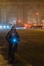 Madrid Spain - January 2021: bike rider in Alacala street with hevy snow due to Filomena Storm. \