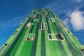 Detail of the facade of a green modern residential building in Vallecas district, in Madrid, Spain.