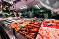 Madrid Spain - January 2021: fish shop with seafood and store owners in Pacifico Market in Spain offering service in the middle