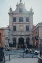 People entering Cathedral Church of the Armed Forces in Madrid, Spain, police guards outside