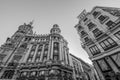 Wide angle street level view of Plaza Canalejas. Edificio Meneses, Casa de Allende buildings and