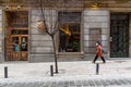 Woman Walking By Empty Tapas Bar in Historic Centre of Madrid