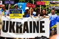 Activists Peaceful protest against Russian aggression A banner with text UKRAINE