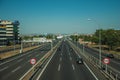 Highway with heavy traffic and SPEED LIMIT signposts in Madrid