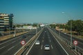 Highway with heavy traffic and SPEED LIMIT signposts in Madrid
