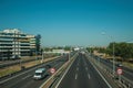 Highway with heavy traffic and SPEED LIMIT signs in Madrid