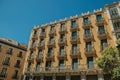 Old building with colorful facade and windows in Madrid