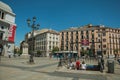 Opera metro station entrance on square with people in Madrid