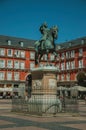 People on the Plaza Mayor with the statue of King Philip III in Madrid