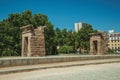 The stone temple of Debod on a wooden garden in Madrid