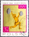Weightlifting, athlete raises a barbell, for the XVIII Summer Olympic Games, Tokyo, 1964 Royalty Free Stock Photo