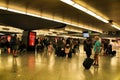 Passengers walking through Atocha train station in Madrid