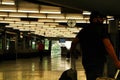 Passengers walking through Atocha train station in Madrid