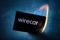 Madrid, Spain - June 27, 2020: Wirecard prepaid card burning on fire following the company bankruptcy and the freezing