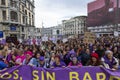 Head of the feminist march and group of protesters concentrated with a protest banner in one of the main streets of central Madrid