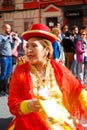 Madrid, Spain, March 2nd 2019: Carnival parade, woman from Bolivian dance group dancing with typical costume