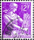 Female harvester, farm woman, in french stamp Royalty Free Stock Photo