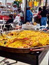 Chulapos eating Spanish Paella at festivity of San Isidro. Madrid.