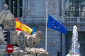 MADRID, SPAIN - MAY 11, 2019: The flags of Spain and the European Union fly in front of the Bank of Spain`s headquarters in the