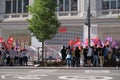 Group of people protesting with CCOO, UGT and Juventud comunista flag in front of a H