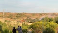 Madrid, Spain - May 16, 2023: Peope watching red fire helicopter landing as live camera passing to yellow chopper flying