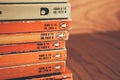 Madrid, Spain, May 10 2021: Stack of old vintage Penguin books on wooden shelf. Royalty Free Stock Photo