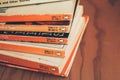 Madrid, Spain, May 10 2021: Stack of old vintage Penguin books on wooden shelf. Royalty Free Stock Photo