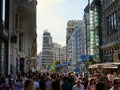 Throng or crowd of people on the Gran Via in the Spanish Capital city. Rush hour in Madrid, Spain