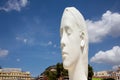 Madrid, Spain. May 9 2022. White sculpture Julia, female head against blue sky