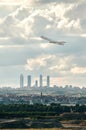 Mitsubishi Crj -1000 aircraft of the Iberia Regional airline taking off from Madrid airport leaving behind a panorama of its famou Royalty Free Stock Photo