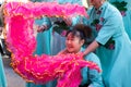 Chinese New Year parade in Usera neighborhood, Madrid. Spain. Participating women dressed in traditional light blue costume