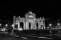 Night view of The Puerta de Alcala at night - a monument in the Independence Square in Madrid, Spain. Black and white Royalty Free Stock Photo