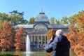 Madrid, Spain, November 07, 2022: Crystal Palace behind the pond in the Buen Retiro park Royalty Free Stock Photo