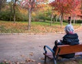 Madrid. Spain November 19, 2022: an elderly lady painting in the Retiro Park