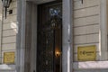 Madrid, Spain, November 07, 2022: Entrance door with sign indicating that it is the Official Chamber of Commerce and Industry of