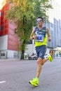 Professional athletes running the Movistar Half Marathon of Madrid through the most central streets of the capital of Spain. Royalty Free Stock Photo