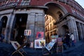 MADRID, SPAIN - NOVEMBER 3, 2010: Street artist sells paintings, scenes from life