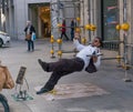 Madrid, Spain - November 11,2017 : Unidentified street performer act like he is a waiter slipping on a banana peel near Peurta del