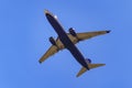 Madrid, Spain, October 30, 2022: Large plane of the Ryanair airline seen from below and flying over the city.