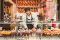 Madrid, Spain - October 7, 2017: Man Selling Iberico Ham at a Food Stall in a Market