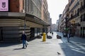 Preciados street in Madrid with fewer people than usual and a man wearing a mask due to the state of alarm