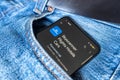 Smartphone with Skyscanner app in a jeans pocket