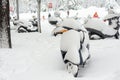 Madrid, Spain, 01.09.2021, Snow covered motorcycles on the street Segovia, The storm Filomena