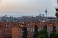 A view over the skyline during sunset of Madrid, with the business district quattro Torres seen from Las Siete Tetas at Tio Pio`s Royalty Free Stock Photo